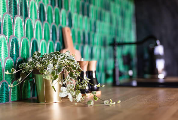 Green leaf tiles in modern kitchen